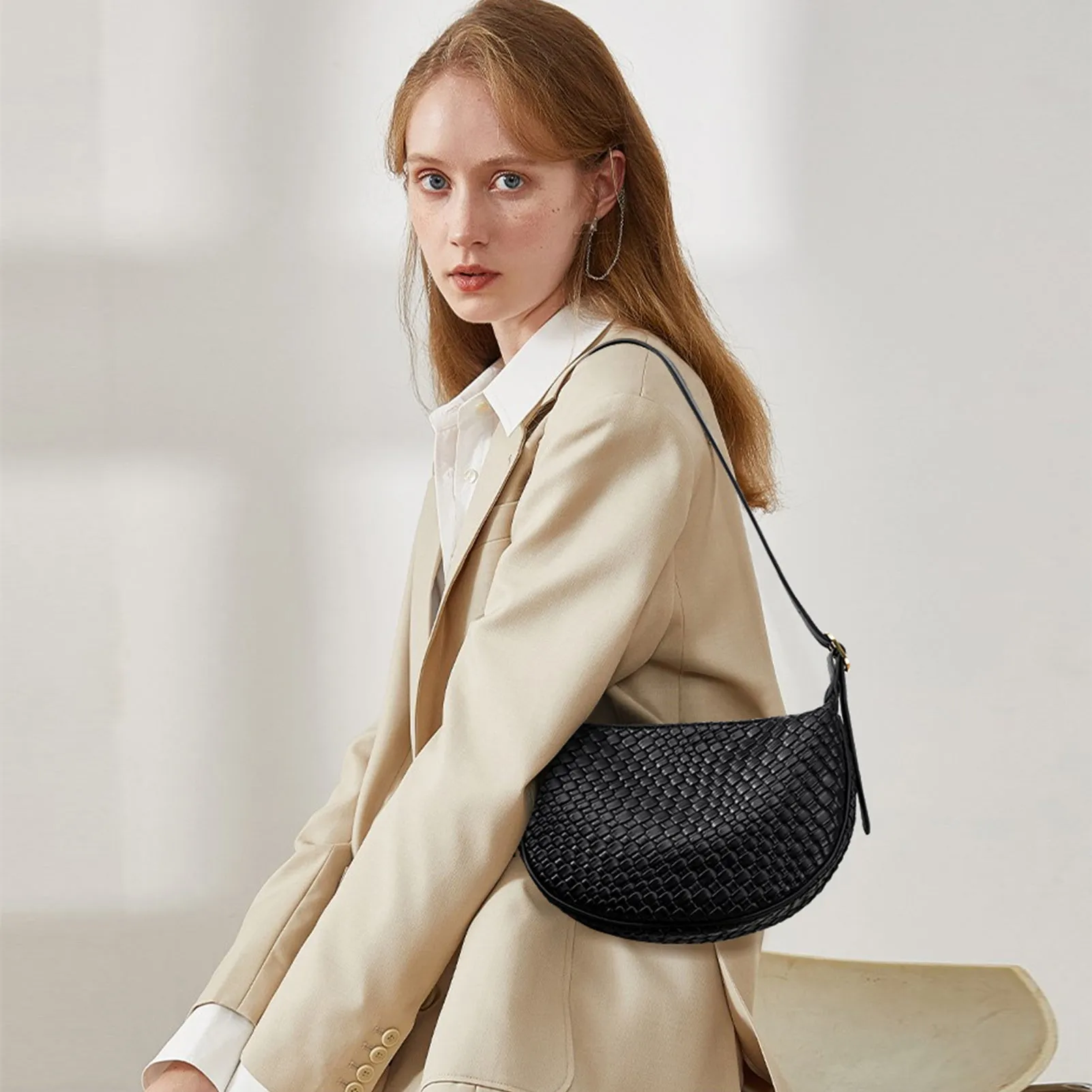 KWELI Woven Leather Half Moon Shoulder Bag