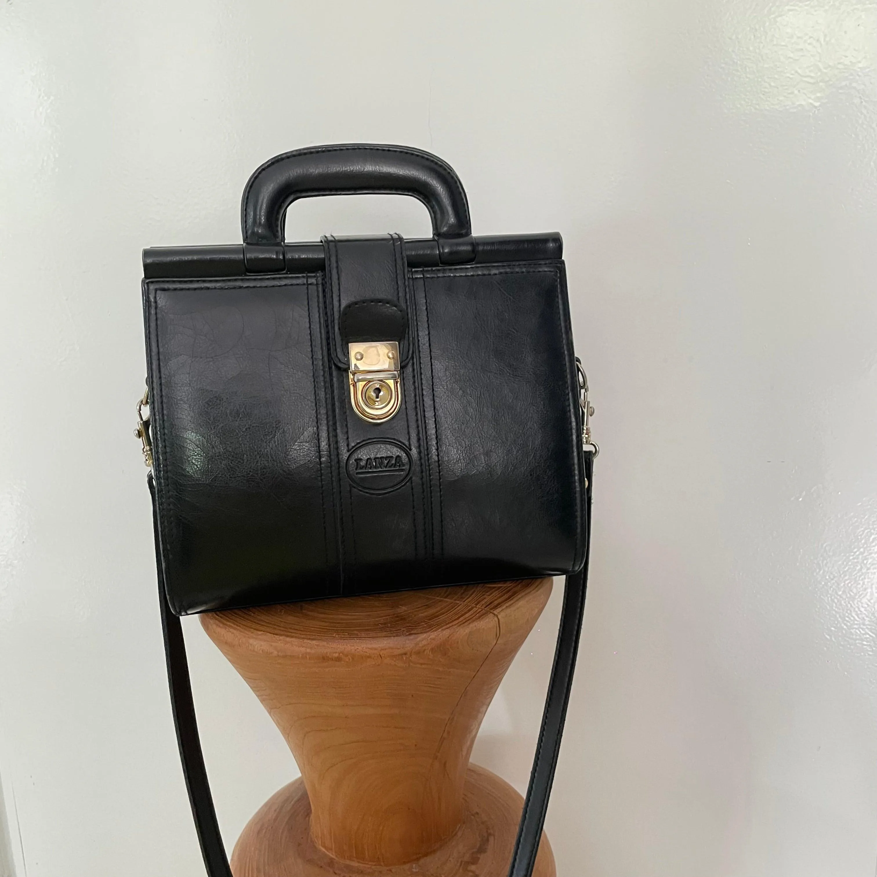 Vintage 1980s signed Lanza Black Leather bag with push lock button